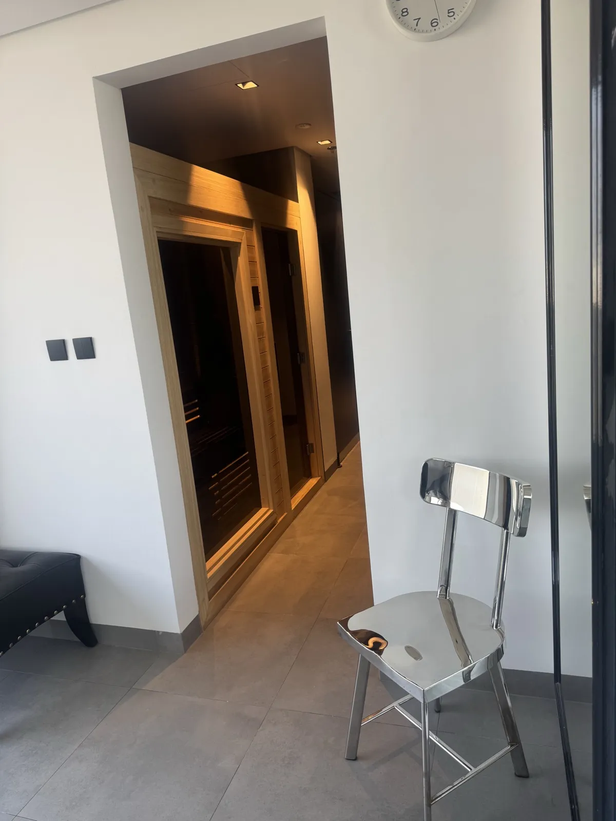 Changing room corridor with a steel chair