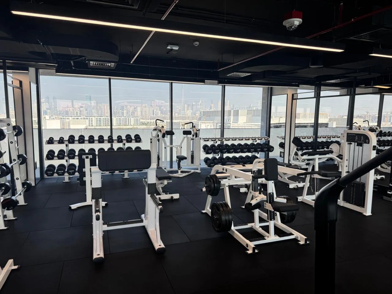 Strength floor with the Dubai skyline beyond the windows