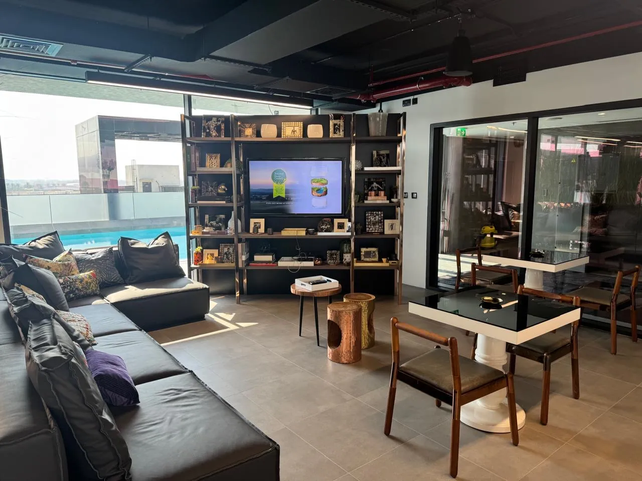 Lounge seating with a dining table and shelving