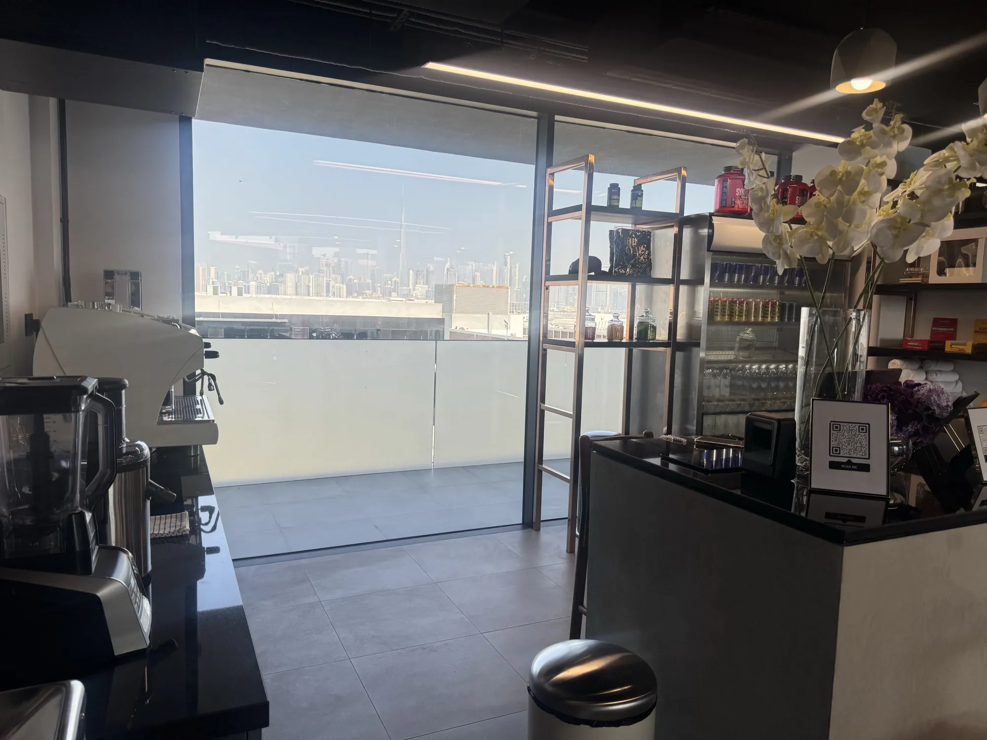 Espresso machine and fresh orchids on The Muscle Bar counter