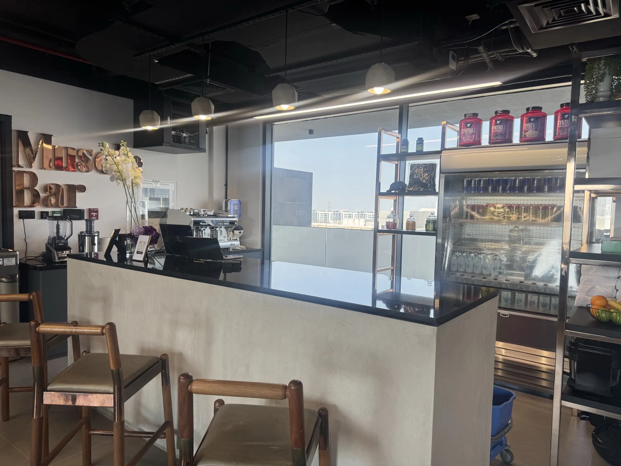 The Muscle Bar counter with its gold lettered sign